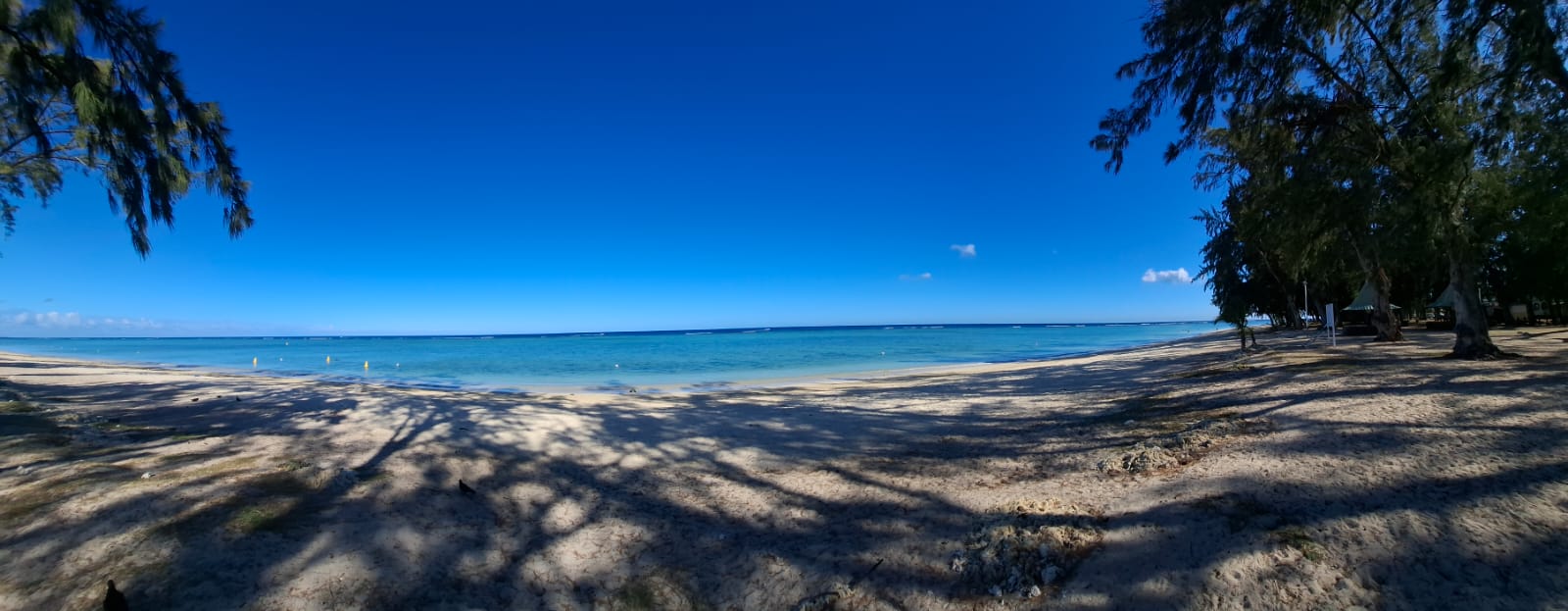 Wide sandy beach and turquoise sea in Mauritius